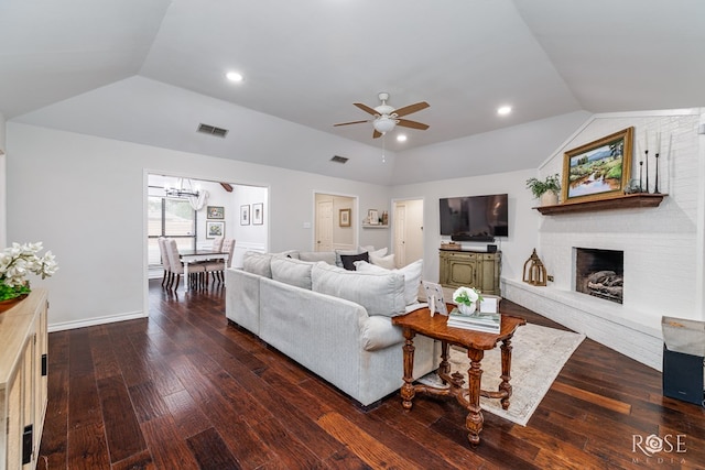 living room featuring vaulted ceiling, a brick fireplace, ceiling fan, wood-type flooring, and recessed lighting