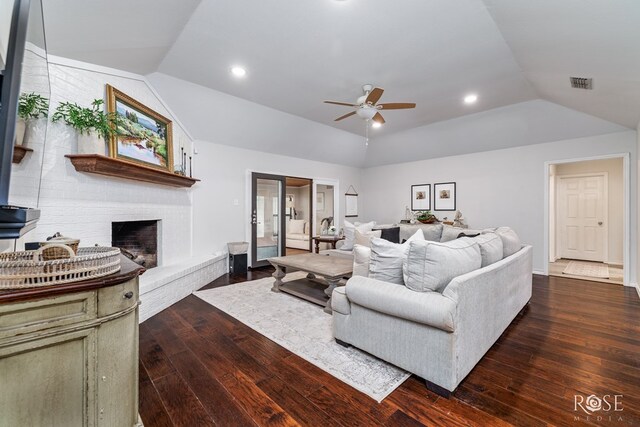 living room with lofted ceiling, hardwood / wood-style floors, a ceiling fan, a fireplace, and recessed lighting