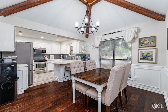 dining space with a chandelier, dark wood-type flooring, and recessed lighting