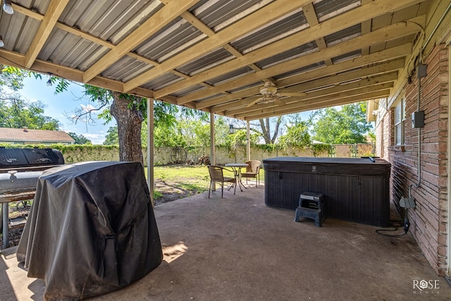 2029 China St, Brady, TX 76825 - fenced backyard with a hot tub, a patio area, grilling area, and a ceiling fan