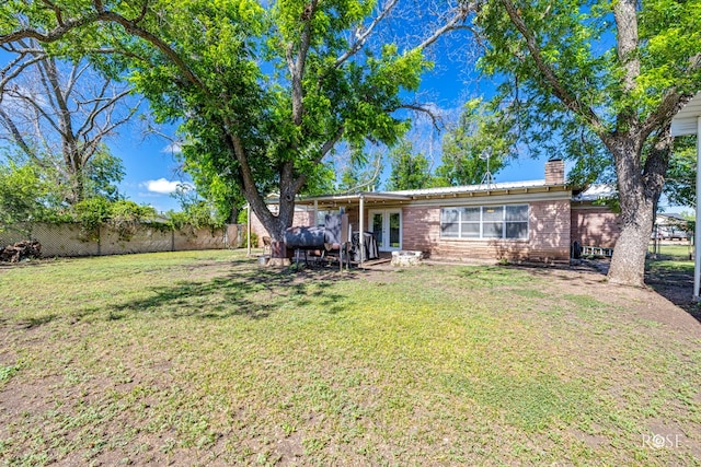2029 China St, Brady, TX 76825 - fenced backyard with french doors