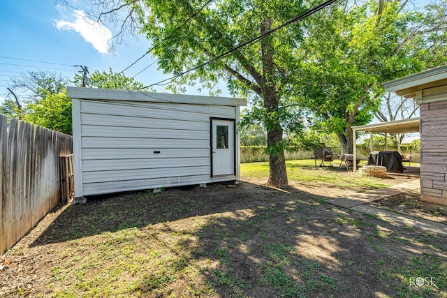 2029 China St, Brady, TX 76825 - fenced backyard with a storage unit