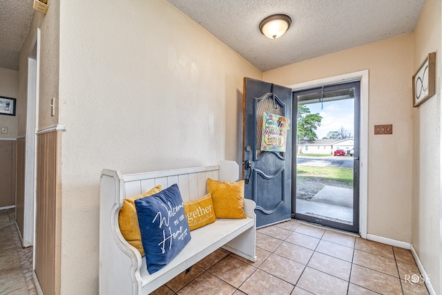 2029 China St, Brady, TX 76825 - foyer entrance featuring a textured ceiling and light tile patterned flooring