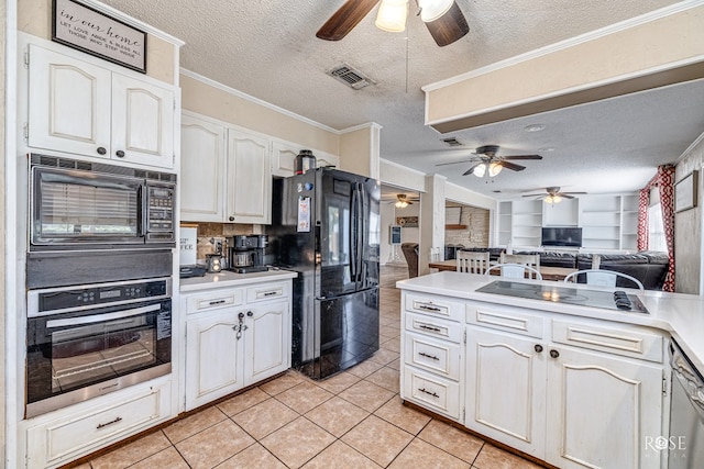 2029 China St, Brady, TX 76825 - kitchen with a ceiling fan, black appliances, a textured ceiling, light tile patterned floors, and open floor plan