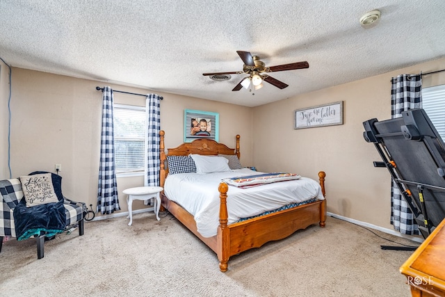 2029 China St, Brady, TX 76825 - bedroom with carpet, a ceiling fan, and a textured ceiling