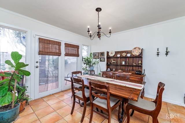 dining area with light tile patterned floors, crown molding, and a notable chandelier