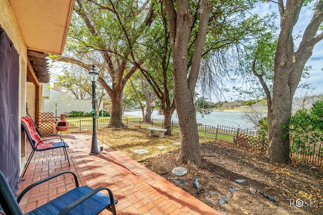 view of patio featuring a water view