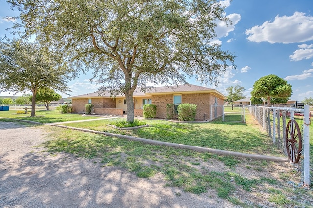 ranch-style house with a front lawn