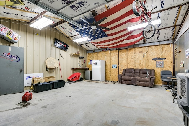 garage featuring white fridge