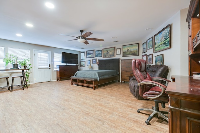 bedroom with ceiling fan and light wood-type flooring