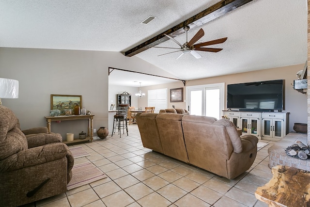 tiled living room with ceiling fan with notable chandelier, lofted ceiling with beams, and a textured ceiling