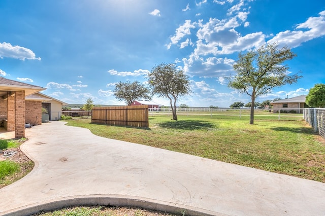 view of yard with a rural view