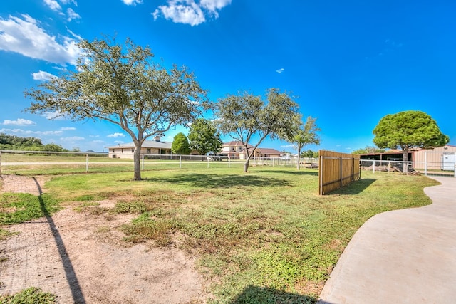 view of yard with a rural view