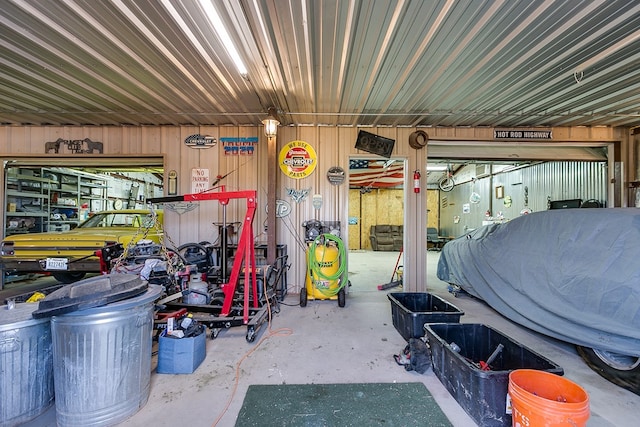 garage featuring wooden walls