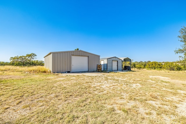 garage featuring a lawn