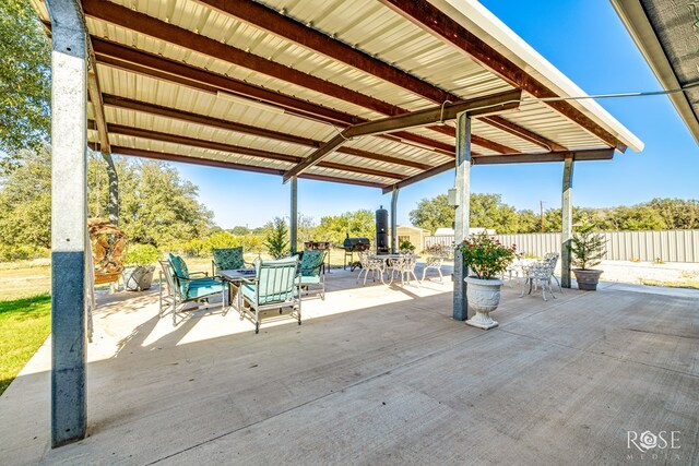 view of patio / terrace with outdoor dining area and fence