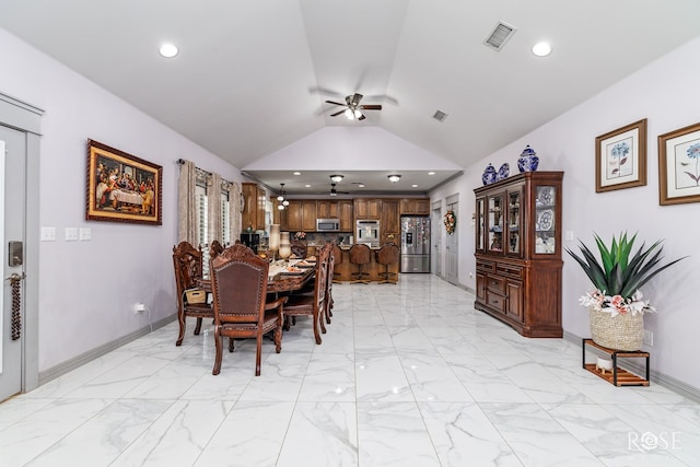 dining room with vaulted ceiling and ceiling fan