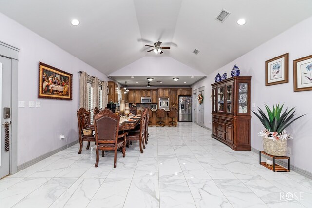 dining area featuring vaulted ceiling, marble finish floor, visible vents, and recessed lighting