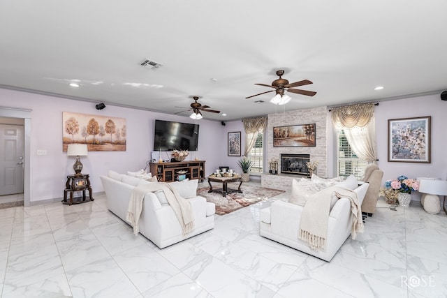 living room with crown molding, a stone fireplace, and ceiling fan