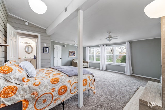 bedroom featuring carpet floors, crown molding, visible vents, lofted ceiling with beams, and baseboards