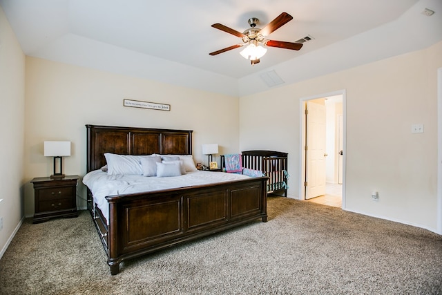 4974 Scarlet Oak Dr, San Angelo, TX 76904 - bedroom featuring light colored carpet, a raised ceiling, ceiling fan, and vaulted ceiling