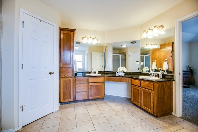 4974 Scarlet Oak Dr, San Angelo, TX 76904 - full bath with double vanity, a shower stall, and tile patterned flooring