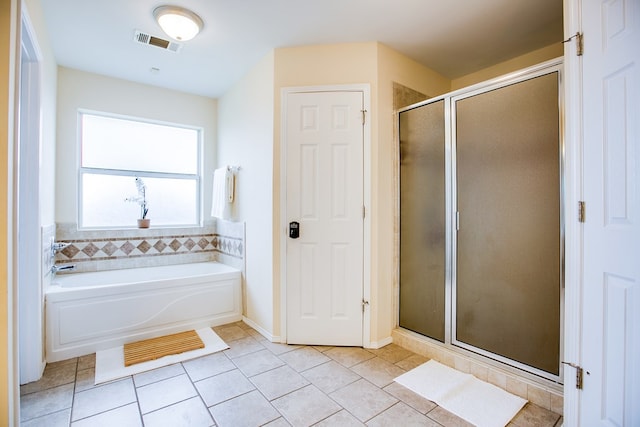 4974 Scarlet Oak Dr, San Angelo, TX 76904 - full bathroom featuring a shower stall, a garden tub, and tile patterned floors