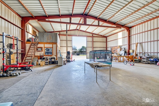 garage featuring metal wall and a trampoline