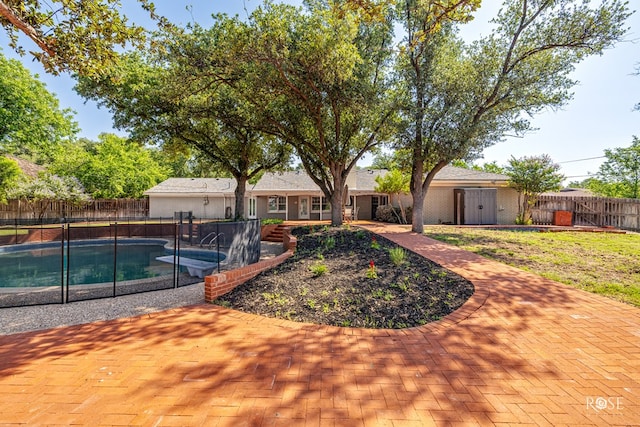 2305 Douglas Dr, San Angelo, TX 76904 - view of swimming pool featuring a fenced backyard and a patio area