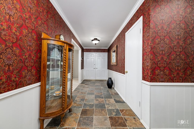 2305 Douglas Dr, San Angelo, TX 76904 - hallway with dark stone finish flooring, crown molding, wallpapered walls, and wainscoting