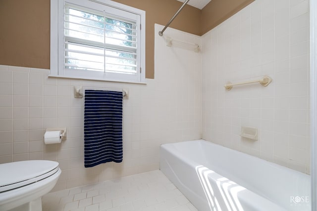 2305 Douglas Dr, San Angelo, TX 76904 - bathroom with tile walls, toilet, and tile patterned flooring