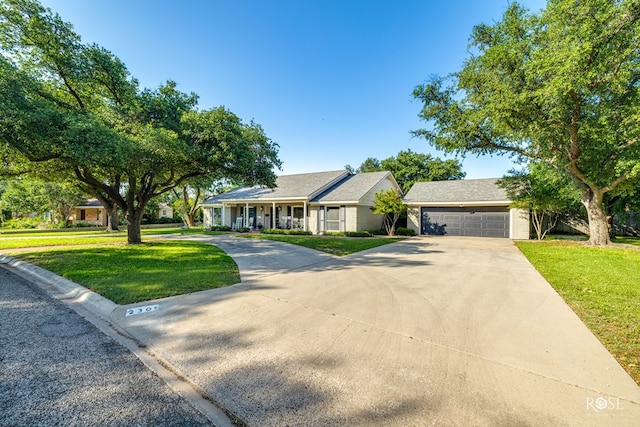 2305 Douglas Dr, San Angelo, TX 76904 - ranch-style home with a front lawn and driveway