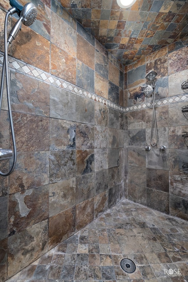 2305 Douglas Dr, San Angelo, TX 76904 - full bathroom featuring stone finish floors and a tile shower