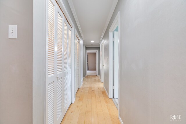 2305 Douglas Dr, San Angelo, TX 76904 - hallway with ornamental molding, light wood finished floors, and baseboards