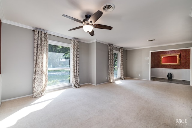 2305 Douglas Dr, San Angelo, TX 76904 - carpeted spare room with ornamental molding, a ceiling fan, and baseboards