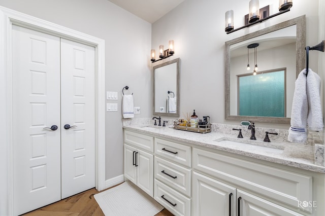 bathroom featuring vanity and wood-type flooring