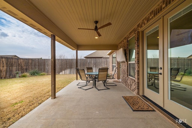 view of patio with french doors and ceiling fan