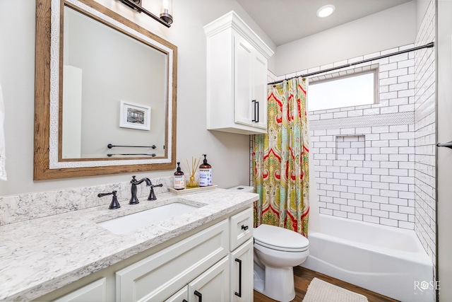 full bathroom with vanity, toilet, shower / tub combo, and wood-type flooring