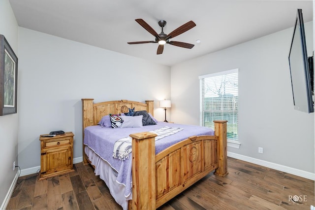 bedroom featuring ceiling fan and dark hardwood / wood-style flooring