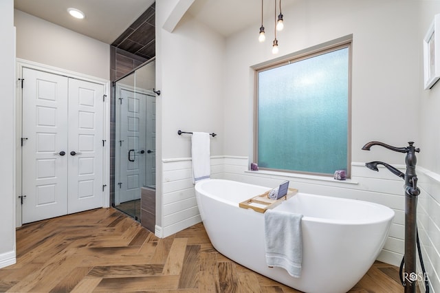 bathroom with shower with separate bathtub and parquet flooring