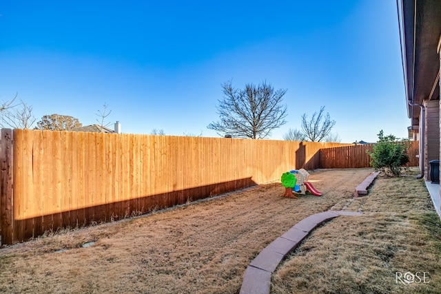 view of yard with a fenced backyard