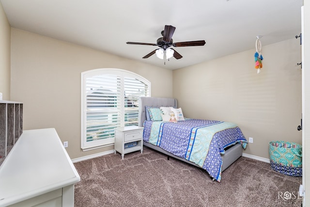 carpeted bedroom with a ceiling fan and baseboards