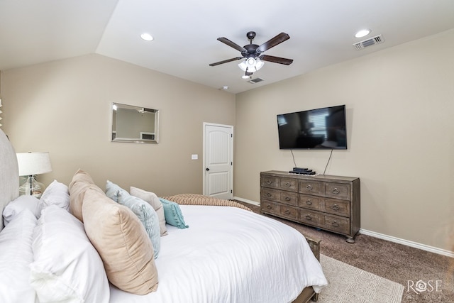 bedroom featuring visible vents, vaulted ceiling, light carpet, and baseboards