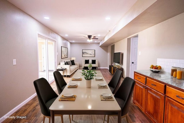 dining room featuring dark wood-type flooring and ceiling fan