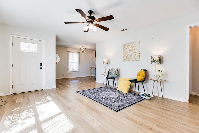 foyer entrance featuring ceiling fan and light hardwood / wood-style flooring