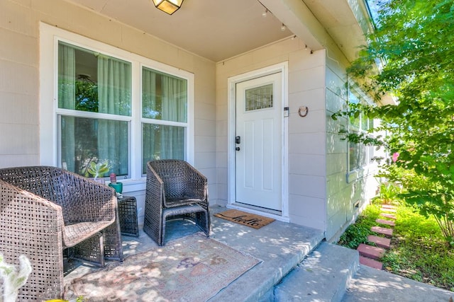 property entrance with a patio area