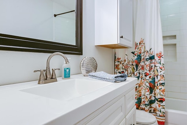 full bathroom featuring shower / bathtub combination with curtain, vanity, and toilet