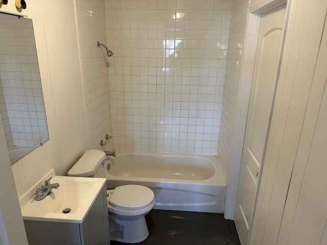 bathroom with tub / shower combination, vanity, and toilet