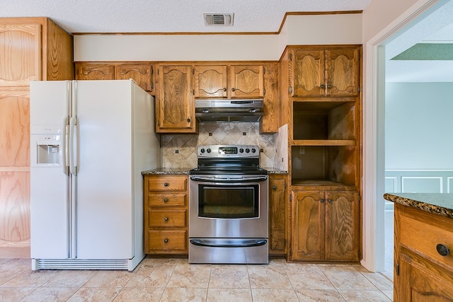 kitchen with tasteful backsplash, a textured ceiling, dark stone countertops, white fridge with ice dispenser, and stainless steel electric stove