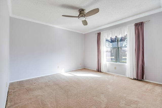 carpeted spare room featuring ornamental molding, ceiling fan, and a textured ceiling